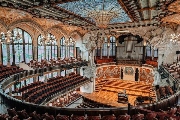 The spectacular stained glass skylight of the Palau de la Música Catalana concert hall, exploding with colour and light above the central performance space