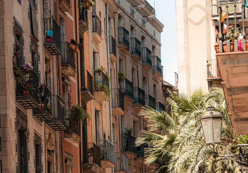 Street scene in El Raval with murals and cafés