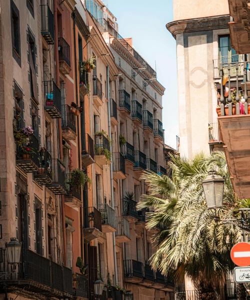 Street scene in El Raval with murals and cafés