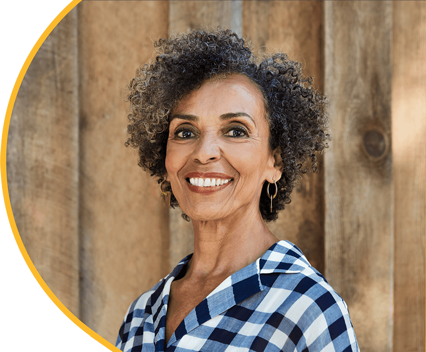 Smiling woman in checked shirt