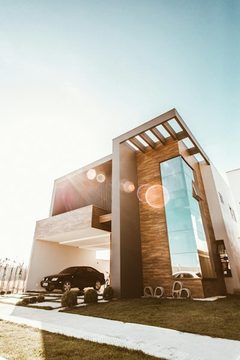 Modern house exterior glows with lights