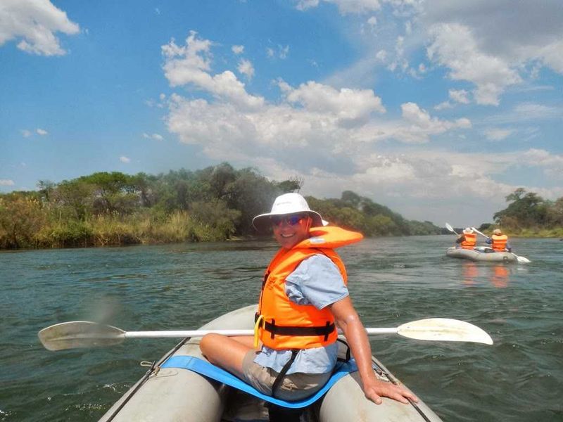 "Then it was time for our canoe trip down the river. This, Aggie had said more than once, is Royal Chundu’s signature activity. It started with a drive through the fishing village where the boats were kept, and where Vasco lives. I had told him that Mark is a former whitewater guide, which delighted him. Africa (1906) There were two inflatable canoes; Mark and S.K. were in one and Vasco and I in the other. We paddled against a current to get out to the main channel, past some hippos which we steered well clear of, and were soon racing through rapids. With the low water it was a little tame, compared to some of the river trips we have been on, but still exhilarating."