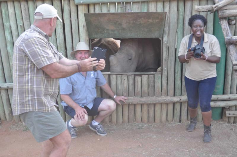 photographer with rhino