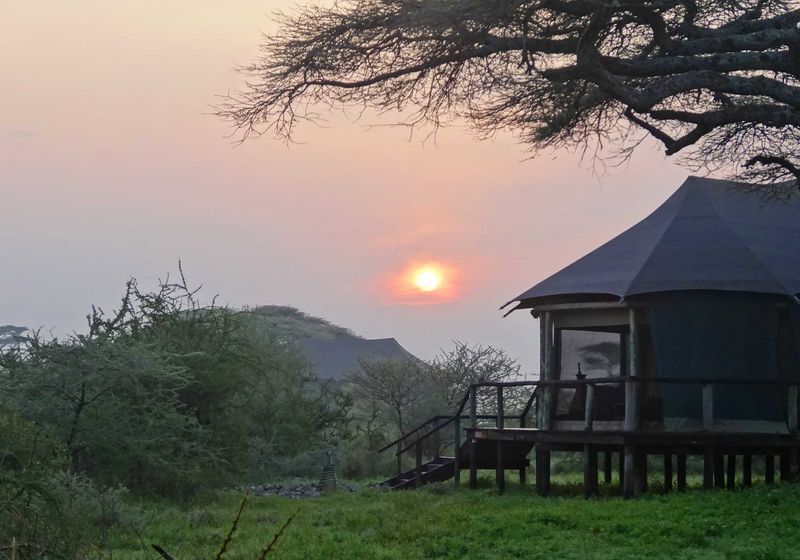 A beautiful African sunrise at our tented camp. - Lake Masek.
