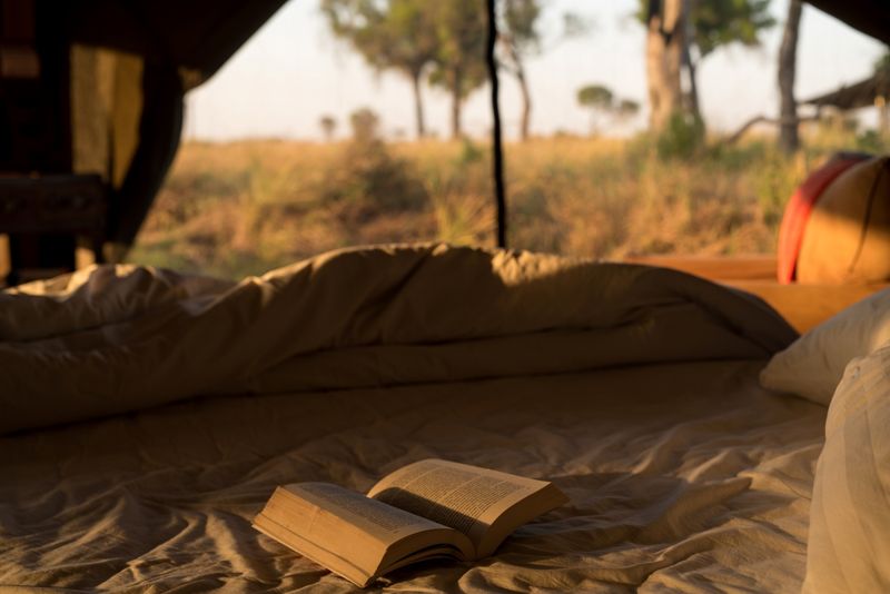 Book on bed in luxury tent