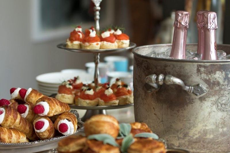 An assortment of pastries and champagne on ice