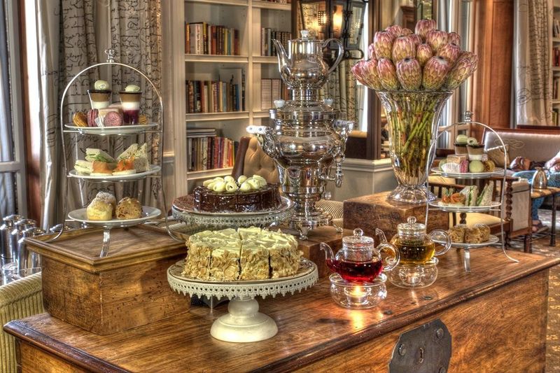 A table set out with cakes and treats at Cape Grace