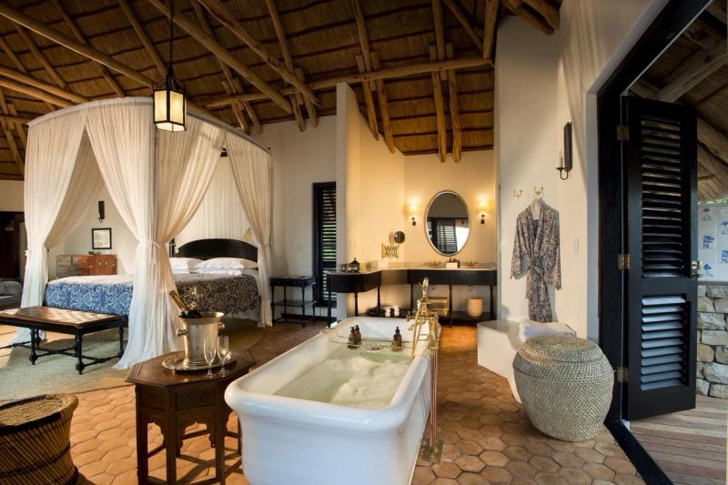View of bathtub and bed in Casinha room AndBeyond Benguerra Island