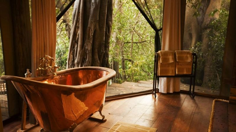 Beautiful copper bath on hardwood floors