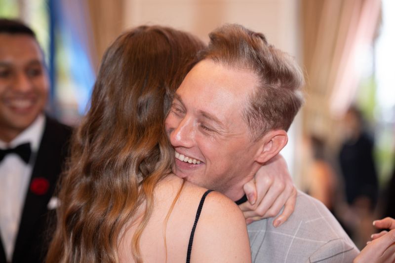 Colleagues hugging