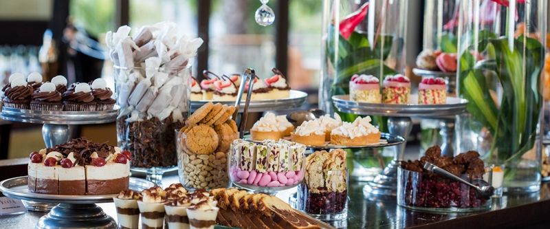 A table set out with treats and flowers at One&Only Hotel
