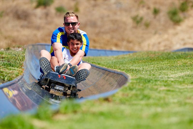 Family enjoying the speedy activities at Cool Runnings