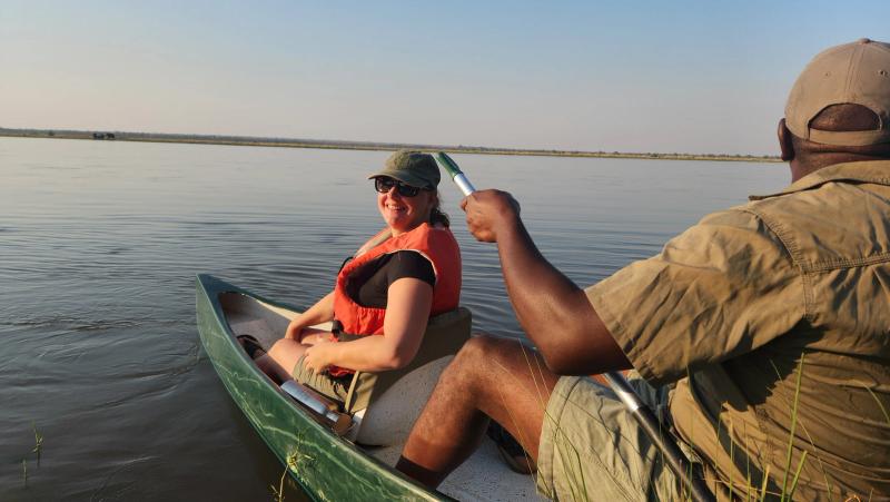 An image of a woman and a guide in a canoe on the Zambezi river
