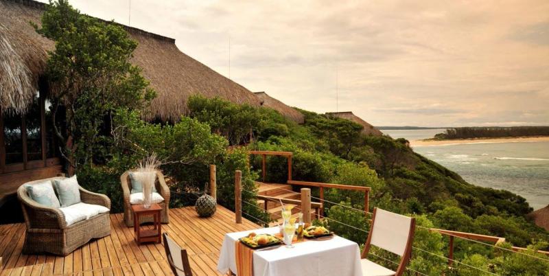 Dining set up oberlooking the ocean at Machangulo Beach Lodge