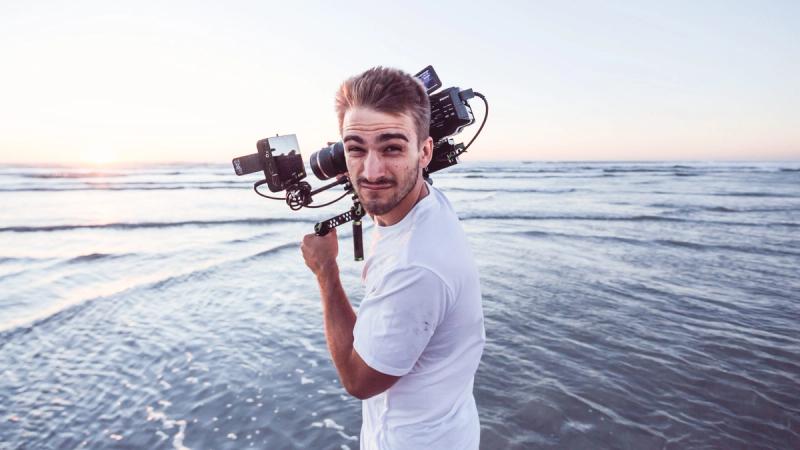 Cameraman hard at work on the beach