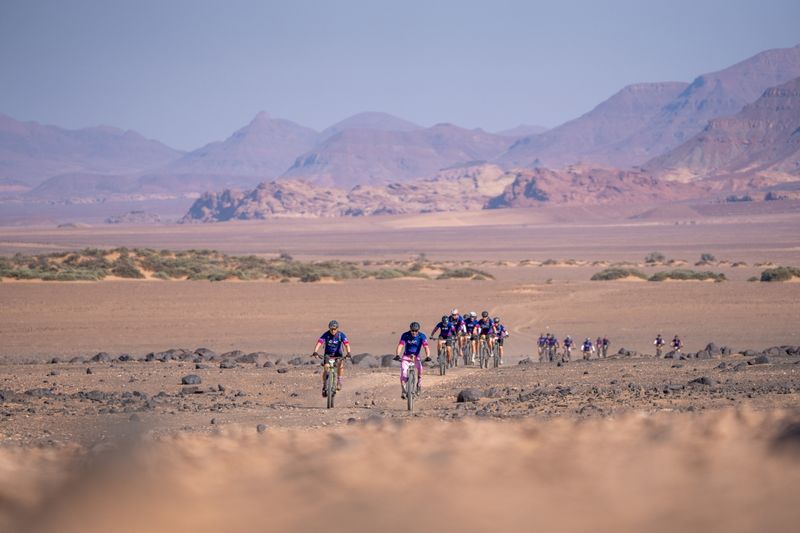 Riders cycling in the desert