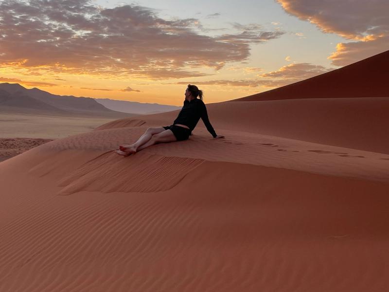 Peggy watching the sunset from a sand dune in the Namib Desert near Sossusvlei, Namibia.