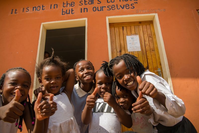Children with smiling faces at Tongabezi Trust School