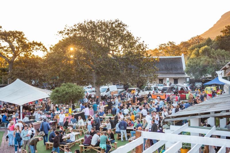 Enjoy a lively atmosphere with fantastic food and drinks at the Noordhoek Farm Village Market