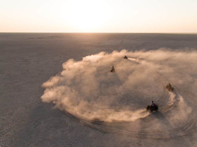 Quad bikes driving across the Makgadikgadi salt pans