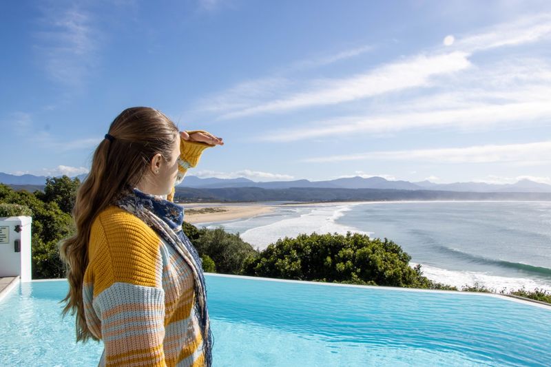 Woman enjoying views of Plettenberg Bay from the Plettenberg Hotel