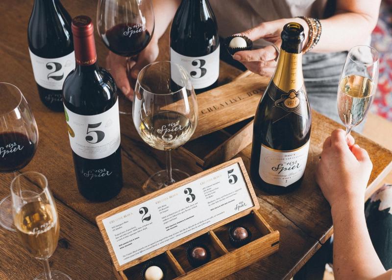 A selection of wines and sparkling wine, paired with chocolates, and presented alongside a tasting menu at Spier Winery.