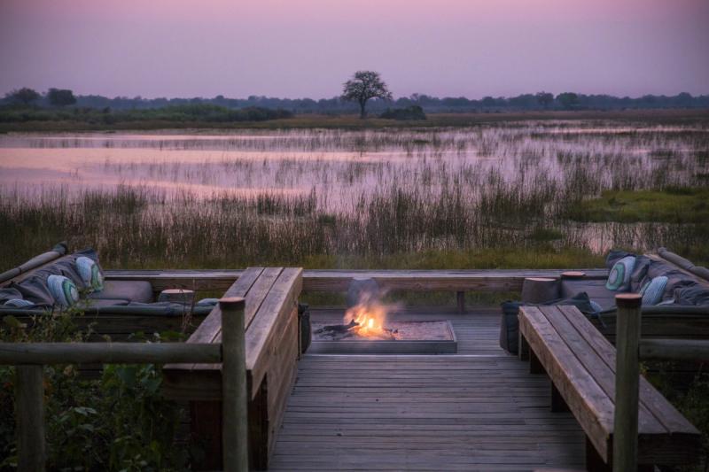 sunset campfire lodge vumbura plains okavango delta botswana