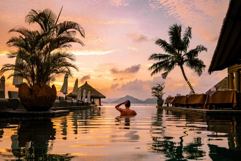 luxury-swimming-pool-tropical-resort-sunset-seychelles