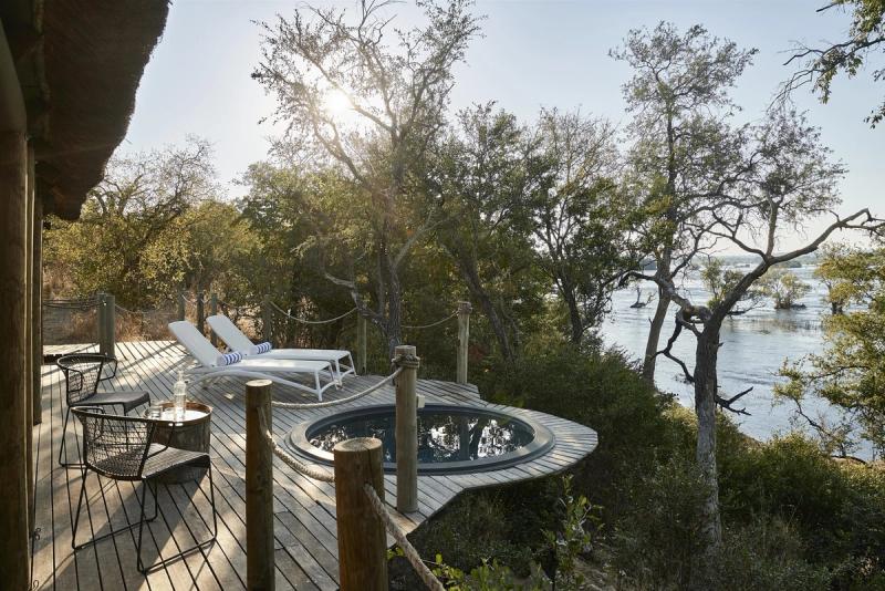 Private riverfront deck at Victoria Falls River Lodge overlooking the Zambezi.
