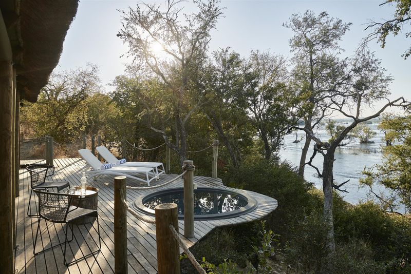 Private riverfront deck at Victoria Falls River Lodge overlooking the Zambezi.