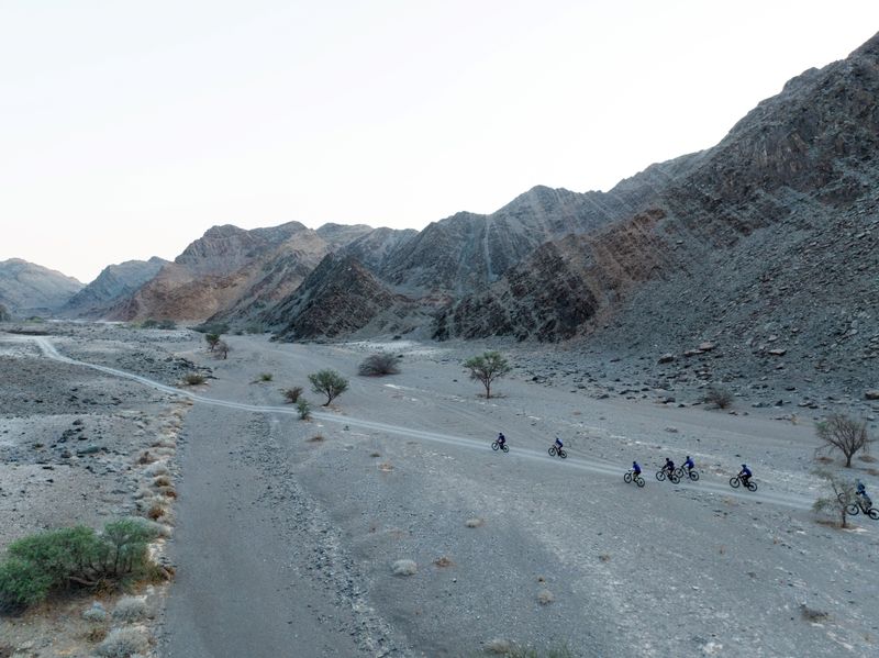 Riders riding out of camp