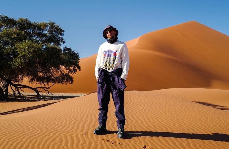 Lewis Hamilton exploring orange dunes in Namibia