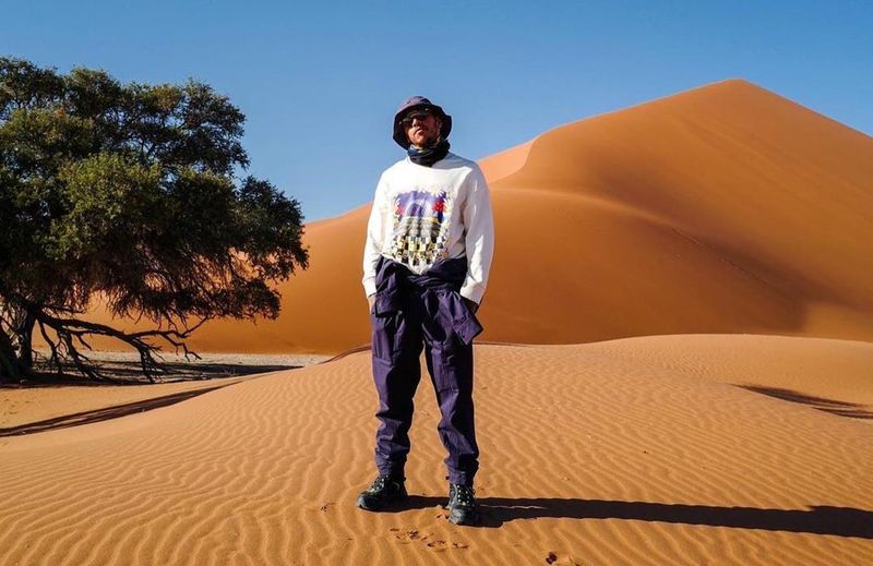 Lewis Hamilton exploring orange dunes in Namibia