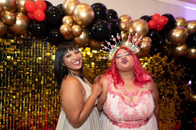 Two of the Rhino Crash members sitting on a couch at a function