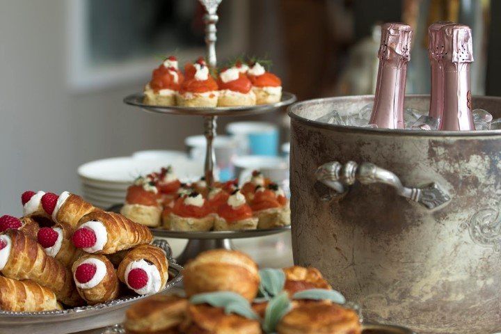 An assortment of pastries and champagne on ice