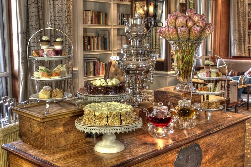 A table set out with cakes and treats at Cape Grace