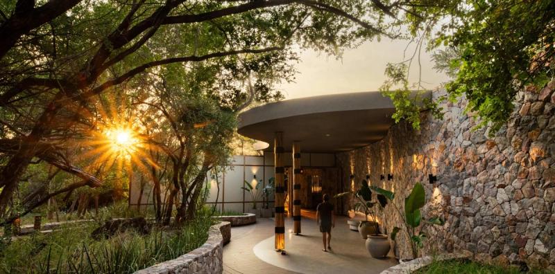 Sunlit entrance walkway of Tanda Tula