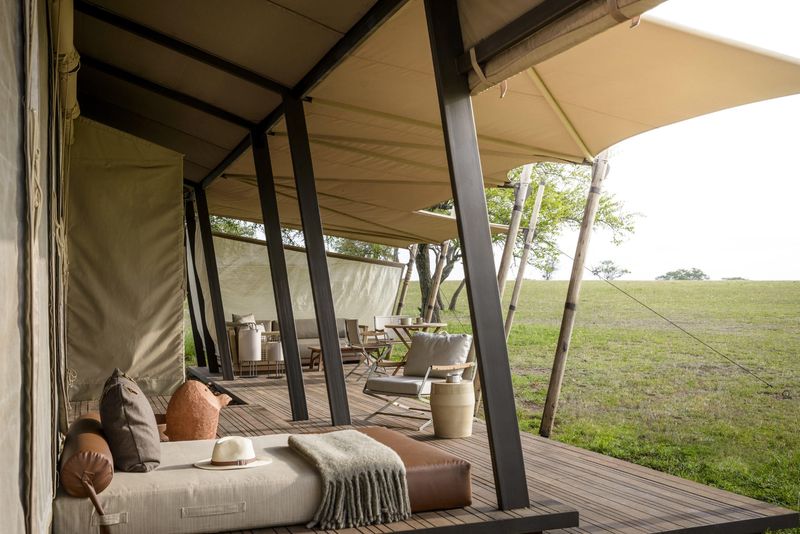 A polished canvas deck overlooks open plains, perfectly capturing the still luxury of African travel in June and July
