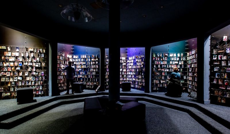 Kigali Genocide Memorial museum section filled with photos donated by victim's families
