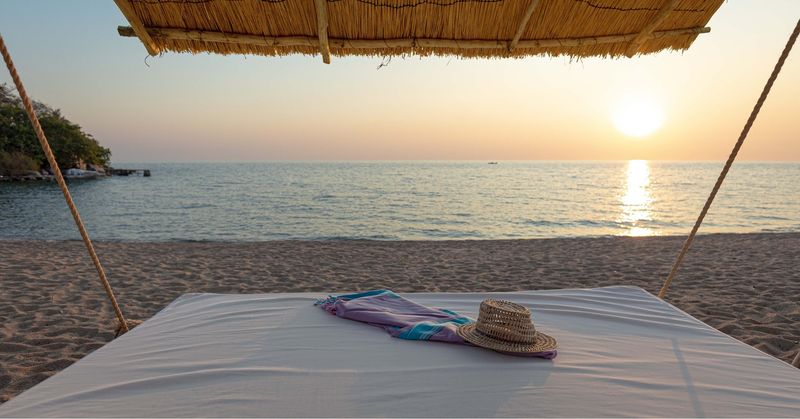 Palapa on the white sandy beaches of Likoma Island in Lake Malawi