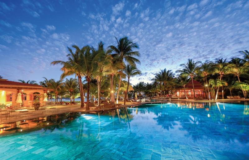 Pool at night at Mauricia Beachcomber Resort & Spa