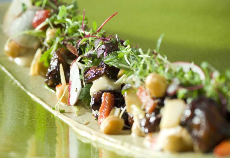 Salad of caramelised aubergine, chickpeas, roasted peppers, candied lemon peel, coriander, mint and miso cream cheese