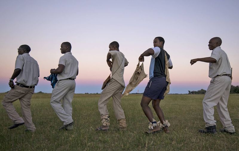 Botswana Moremi Okovango Delta staff dancing
