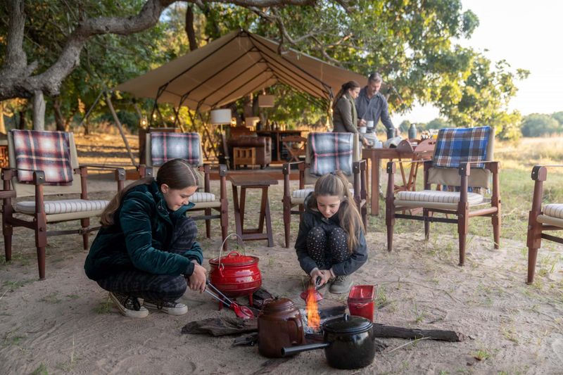 Family bonding in the bush at Time + Tide Luwi Bush Camp