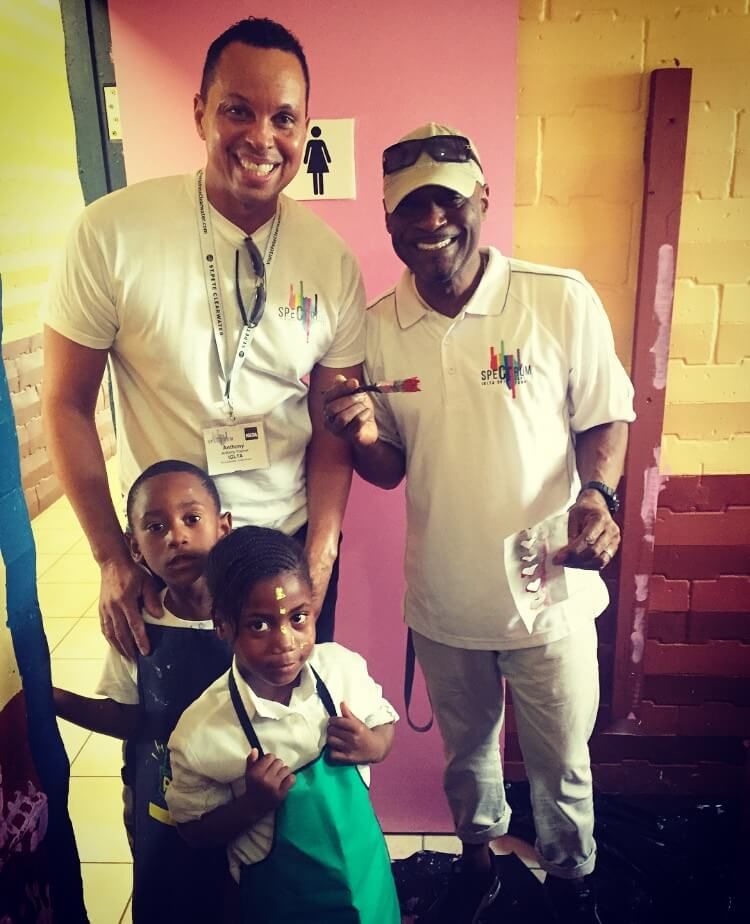 IGLTA volunteers painting with kids