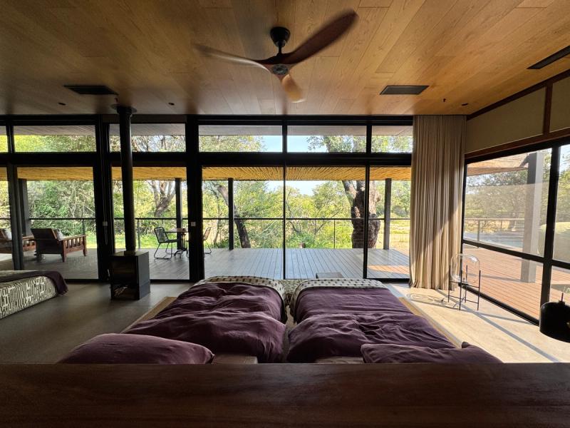 A bedroom suite in Tanda Tula, overlooking the wilderness beyond - one of the best stays on a South Africa safari