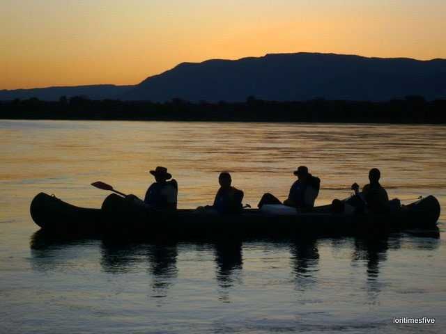 "At the end of our paddle all of us came close together, three boats side by side. Paddles were put down and we drifted in silence ~ taking it all in. One big collective sigh..." | The Zambezi River