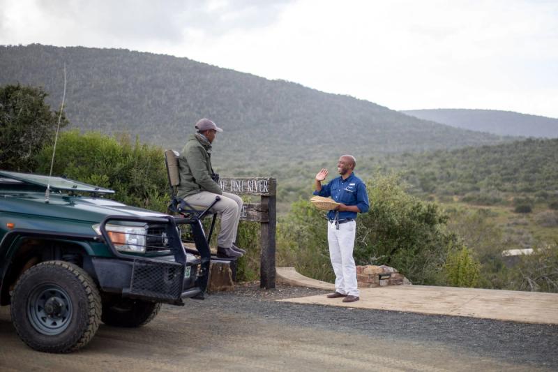 Staff greets guests at entrance of Great Fish River Lodge in Kwandwe Private Game Reserve