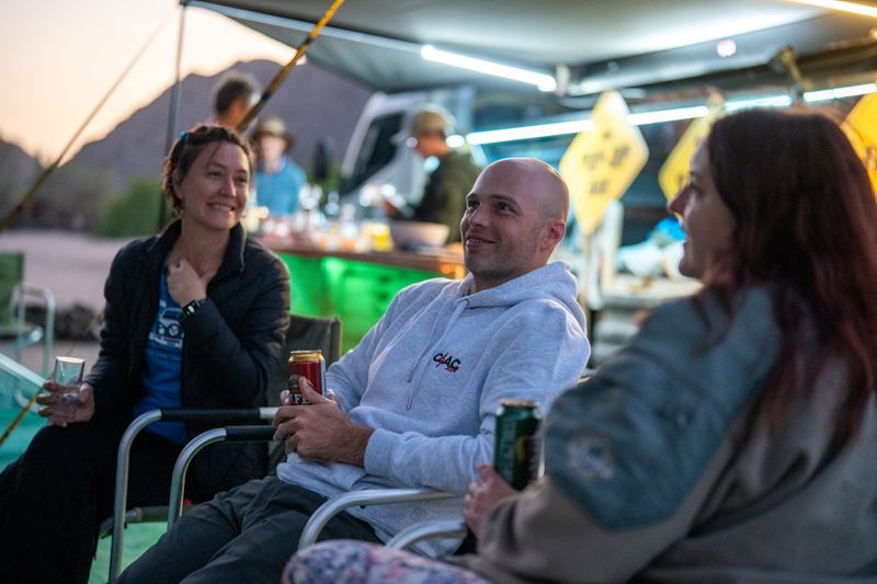 Michelle with her colleagues and fellow riders enjoying a drink
