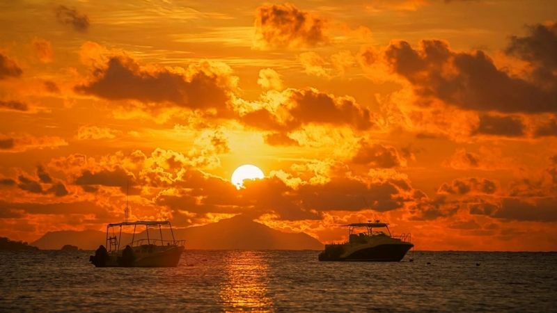 Two fishing boats at sunset